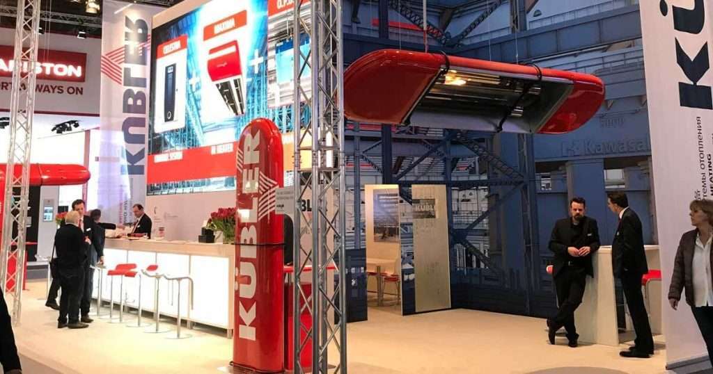 Kübler exhibition stand at industrial exhibition featuring heating systems