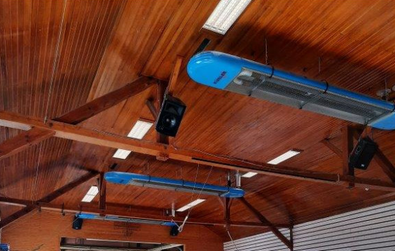 Radiant heater installed on wooden ceiling.