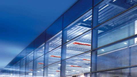 Modern office building facade at night.